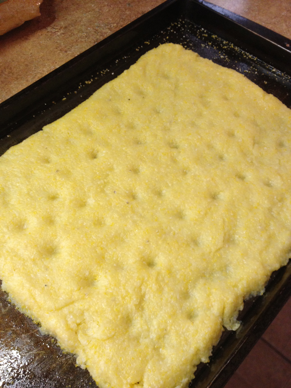 The polenta crust, shaped and ready to bake.