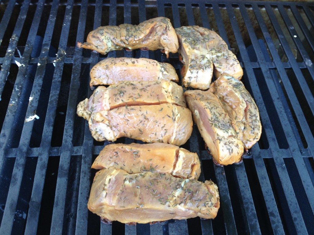 The ribs are placed in the middle of the grill over extremely low heat. The burner on both sides of the ribs are turned up to medium, to allow indirect heating.