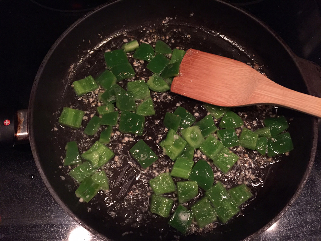 Step 1. Stir together the garlic, onion and peppers in olive oil.