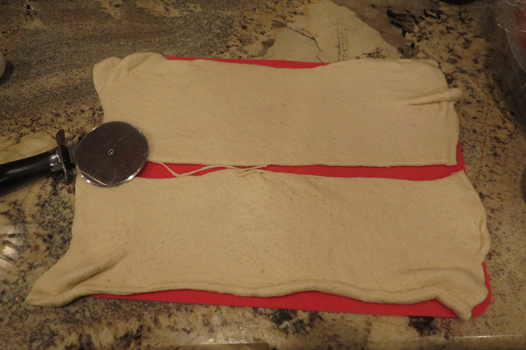 Step 2: Cut the dough in half, length-wise.