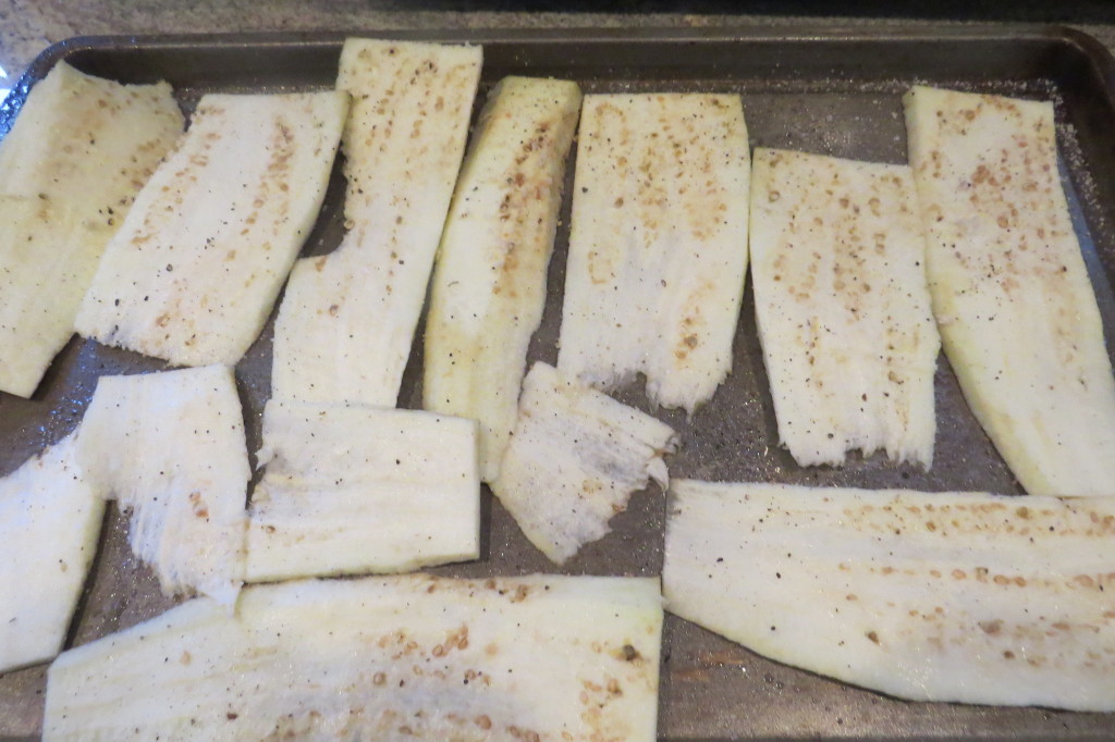 Thinly sliced seasoned eggplant on a lightly oiled baking sheet, baked at 350˚ for 5-10 minutes until softened.