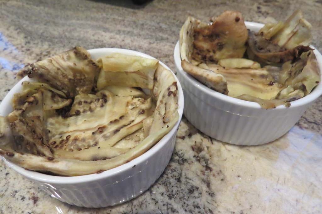 Ramekin dishes liked with the eggplant slices.