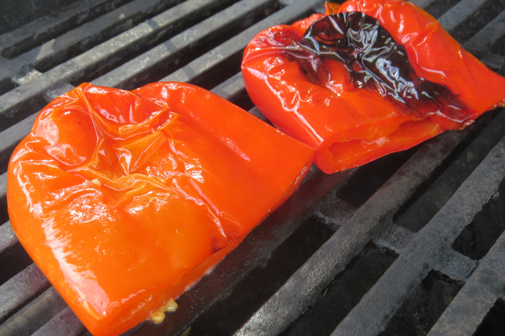 Step 3 - remove the peppers from the tray, reserving the foil covering and the oil and garlic marinade. Lay the peppers over direct high heat. Grill for 20 minutes, or until both sides of the peppers are charred and start to blister, flipping occasionally.